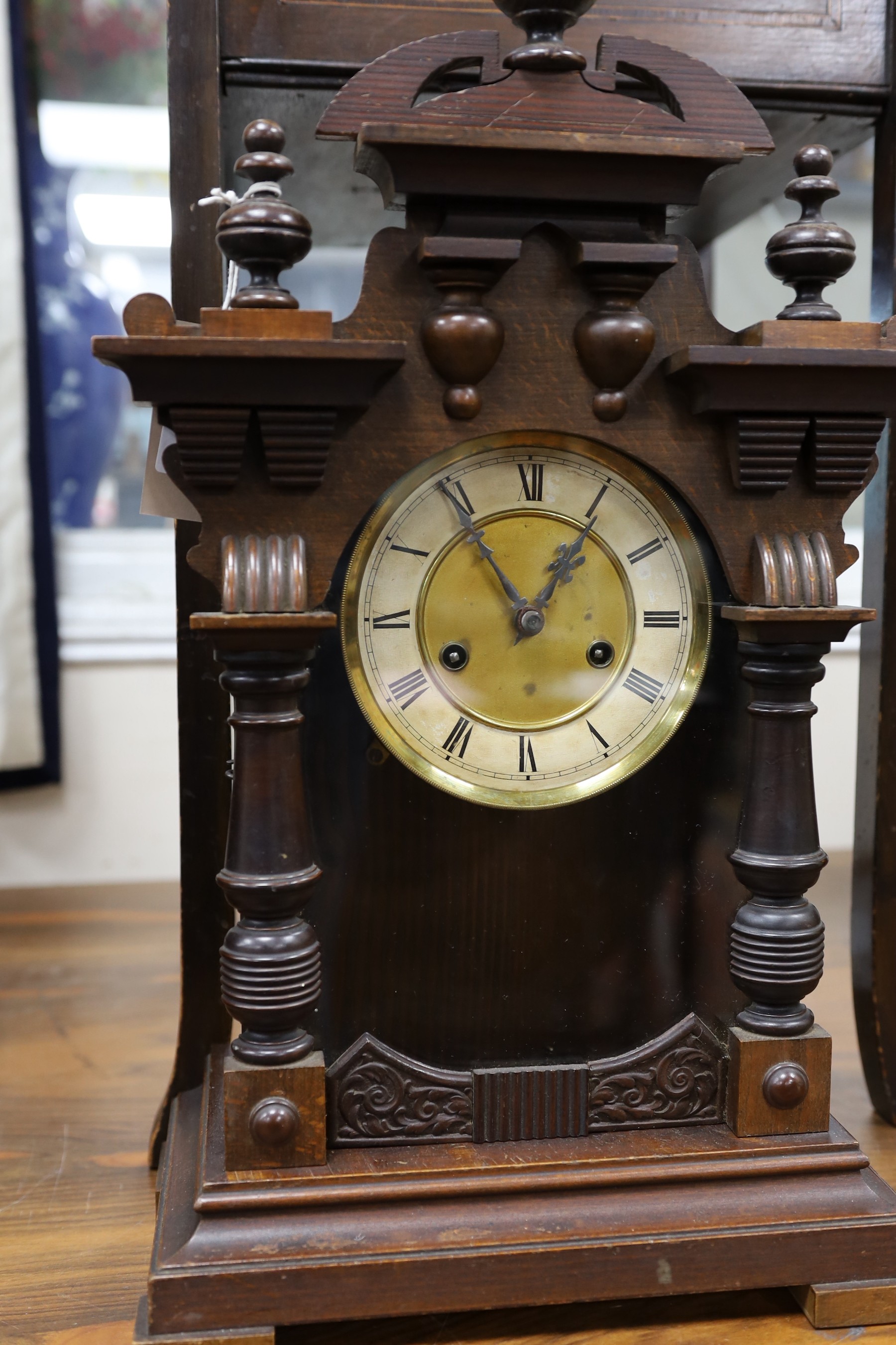 An inlaid mahogany work table, with spring loaded drawer, and a 19th century Black Forest mantel clock